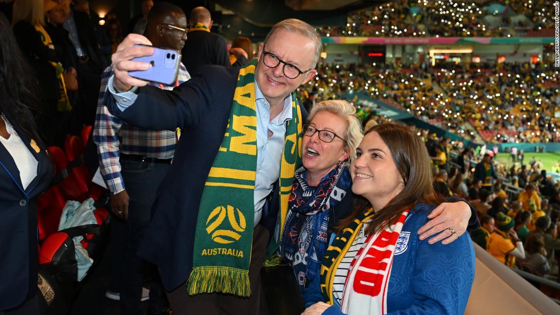 Australian Prime Minister Anthony Albanese takes a selfie with fans before the Nigeria match in Brisbane.