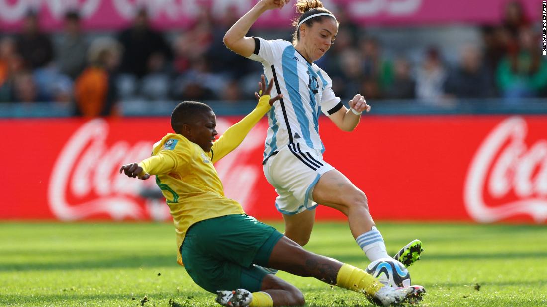 South Africa&#39;s Bambanani Mbane slides in for a tackle against Argentina&#39;s Mariana Larroquette on July 28. Their match ended in a 2-2 draw.