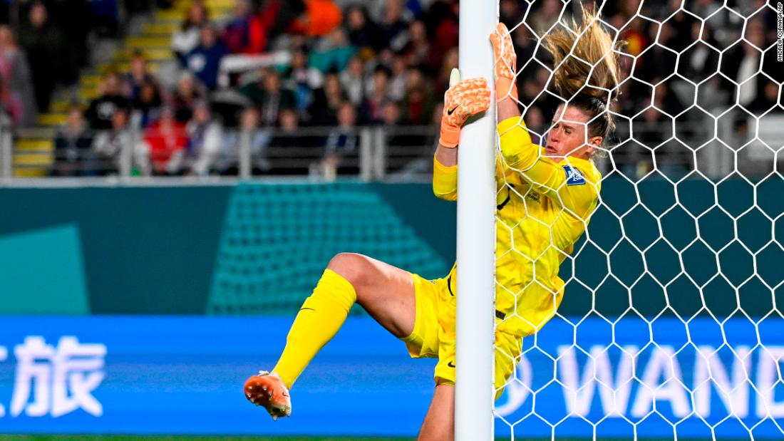 US goalkeeper Alyssa Naeher collides with the post.