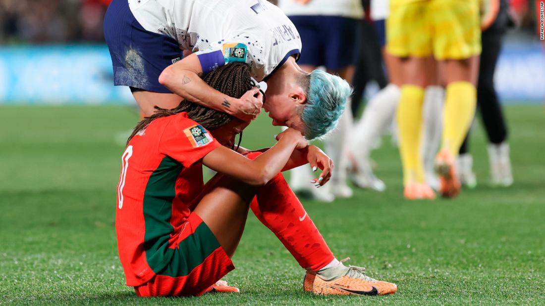 Megan Rapinoe consoles Portugal&#39;s Jessica Silva following the draw, which knocked Portugal out of the competition.