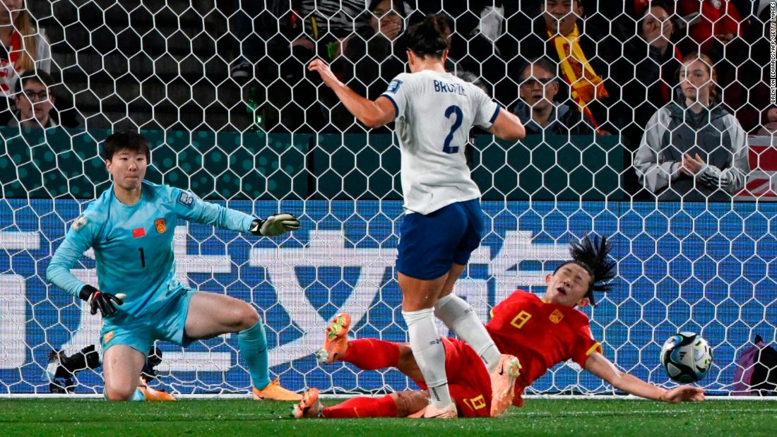 Chinese defender Yao Wei, right, blocks a shot from England&#39;s Lucy Bronze.