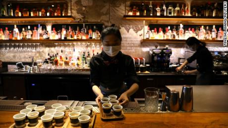 A barista serves coffee at a Starbucks flagship store in Beijing, China January 18, 2022. 