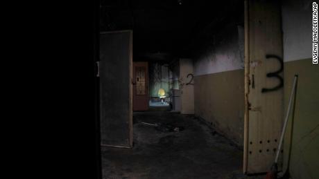 A chair is seen down the hallway of a building which Ukrainian civilians said had been used as a torture center by Russian forces in Kherson, Ukraine, on December 8, 2022.