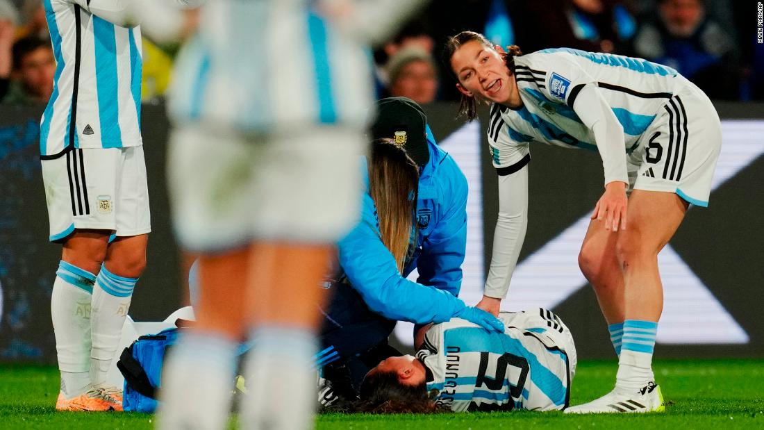 Argentina&#39;s Florencia Bonsegundo lies on the pitch after getting injured against Sweden.
