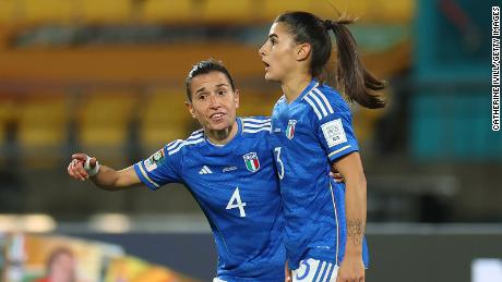 Benedetta Orsi is consoled by her teammate Lucia Di Guglielmo after scoring an own goal against South Africa.