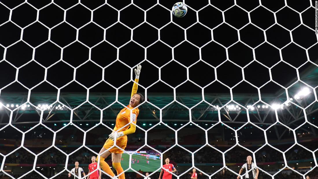 South Korean goalkeeper Kim Jung-mi dives for the ball during the match against Germany.