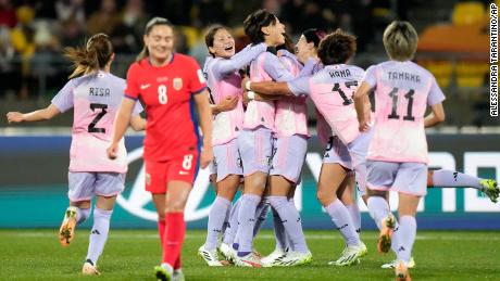 Japan&#39;s players celebrate after the opening goal against Norway.