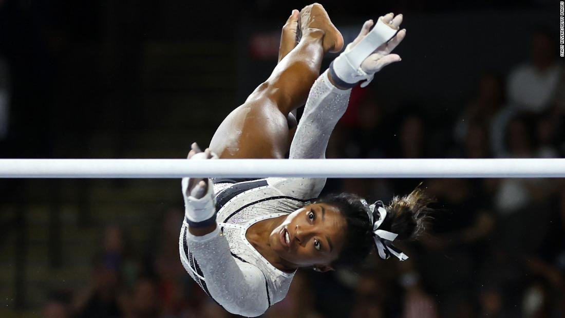 Biles competes in the uneven bars at the &lt;a href=&quot;https://www.cnn.com/2023/08/05/sport/simone-biles-gymnastics-return-spt-intl/index.html&quot; target=&quot;_blank&quot;&gt;Core Hydration Classic&lt;/a&gt; in August 2023. It was her first competitive event since 2021, and she won the all-around.