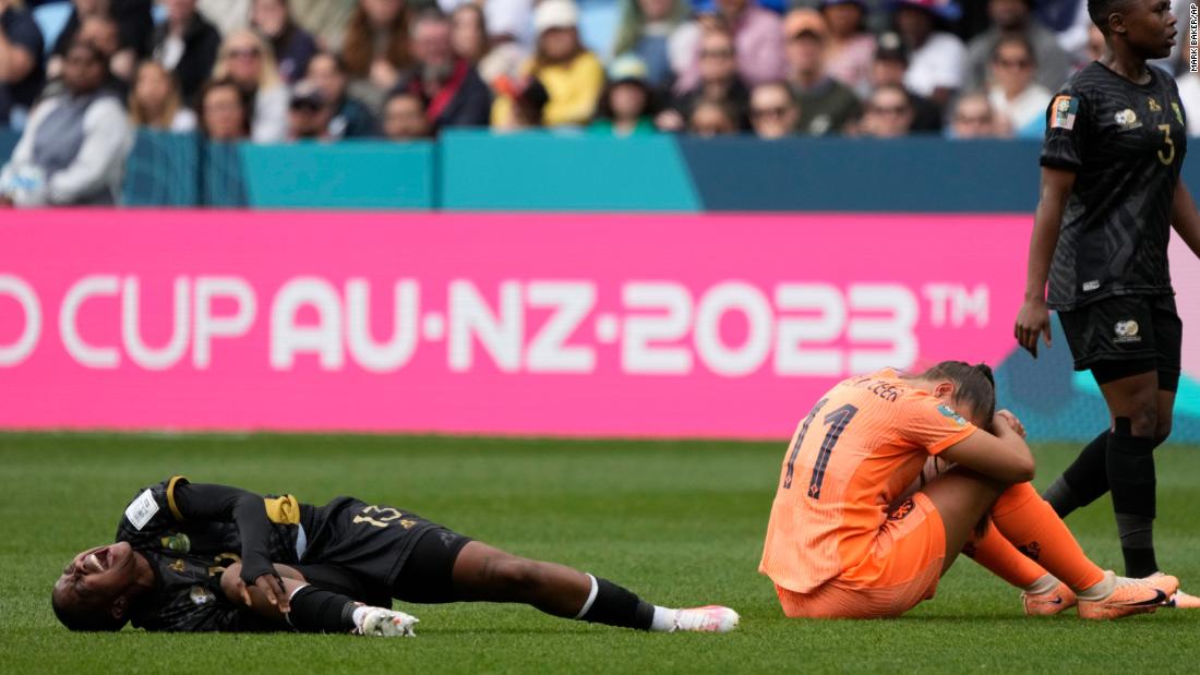 South Africa&#39;s Bambanani Mbane grimaces after colliding with the Netherlands&#39; Lieke Martens. She was taken off on a stretcher shortly after.