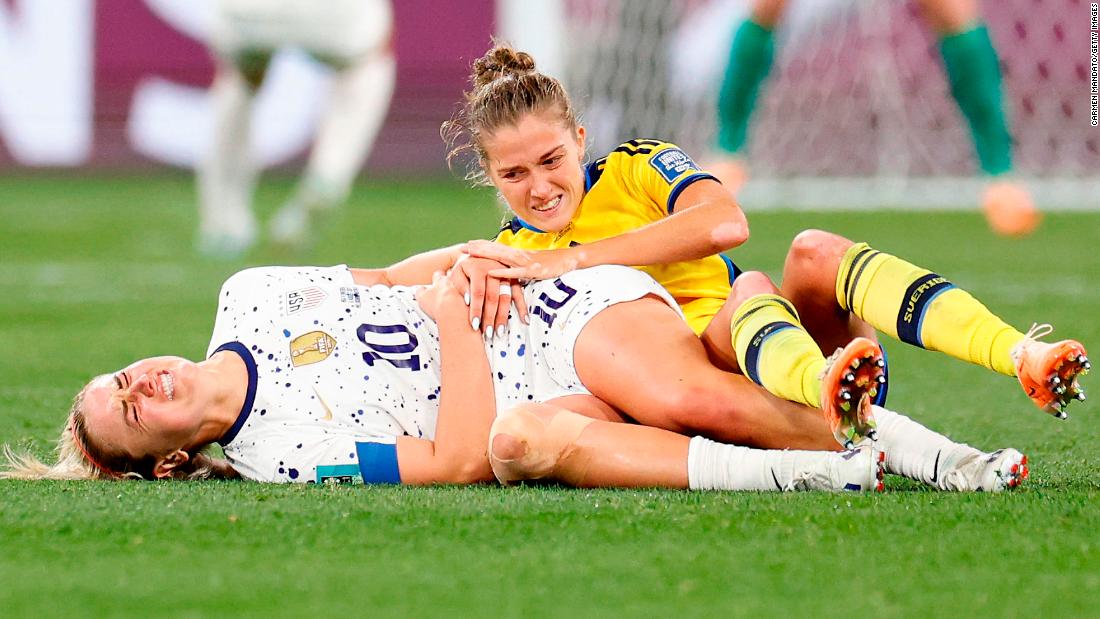 US midfielder Lindsey Horan grimaces in pain after a collision.