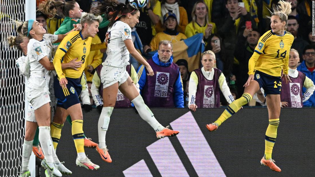 Morgan heads the ball against Sweden.