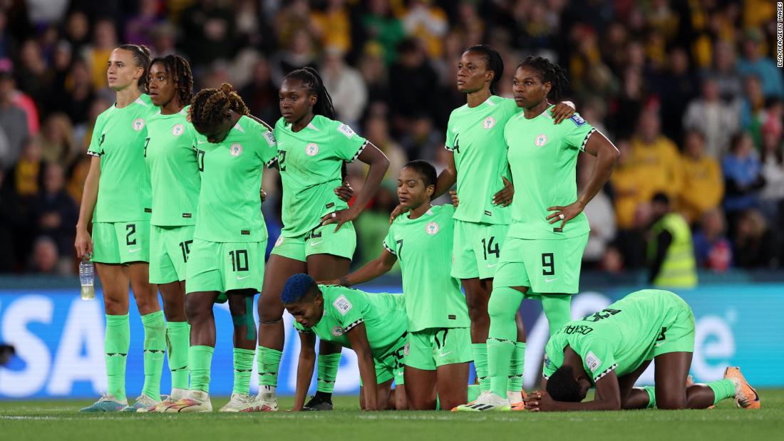Members of Nigeria&#39;s team react during the penalty shootout.
