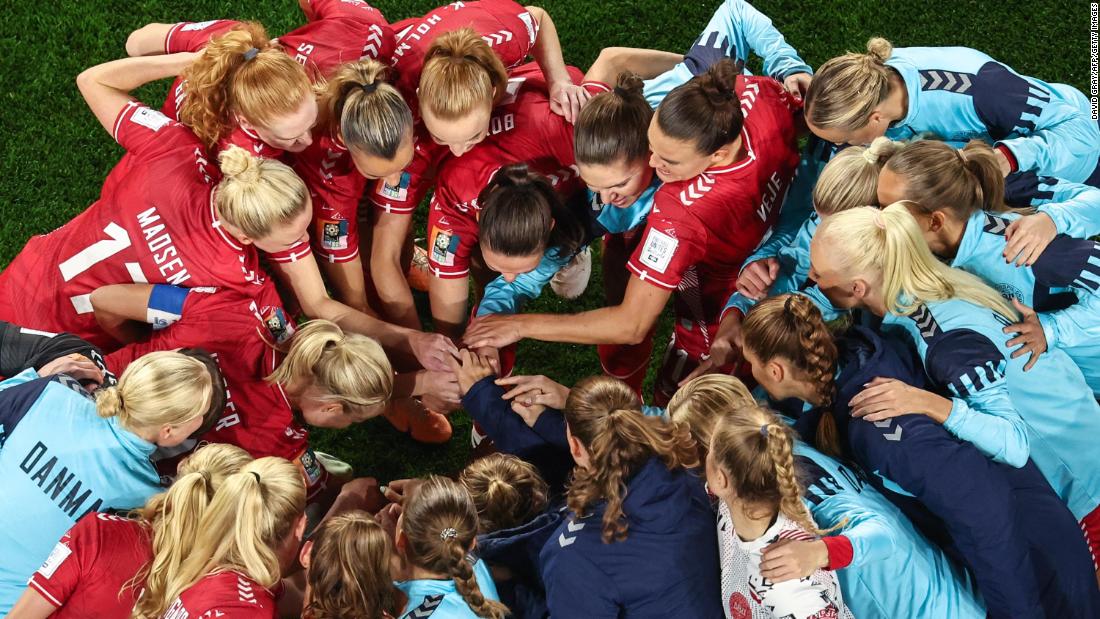 Denmark&#39;s players gather in a huddle before the match against Australia.