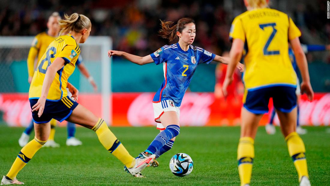 Japan&#39;s Risa Shimizu dribbles the ball during the match against Sweden.
