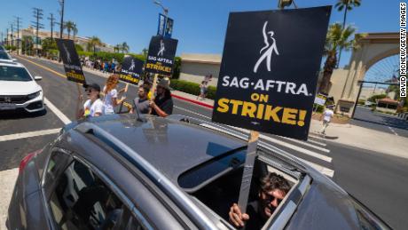 LOS ANGELES, CALIFORNIA - Members of the Hollywood actors SAG-AFTRA union walk a picket line with screen writers outside of Paramount Studios on the first day of the actors&#39; strike which piles on top of the Hollywood writers WGA union strike. (Photo by David McNew/Getty Images)