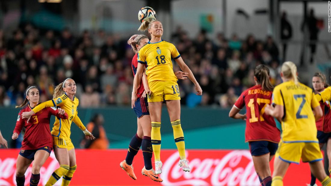 Sweden&#39;s Fridolina Rolfo jumps for a header with Spain&#39;s Alexia Putellas.