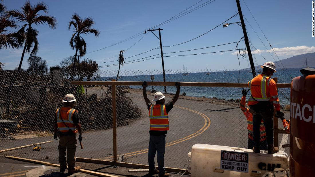 Fences are built around destroyed neighborhoods in Lahaina on August 17.