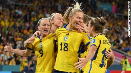 Fridolina Rolfö celebrates with her teammates after scoring.