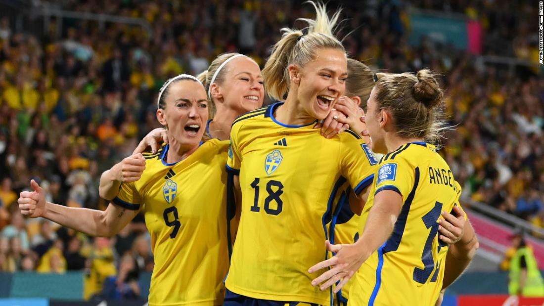 Sweden&#39;s Fridolina Rolfo celebrates with teammates after scoring her team&#39;s first goal against Australia.