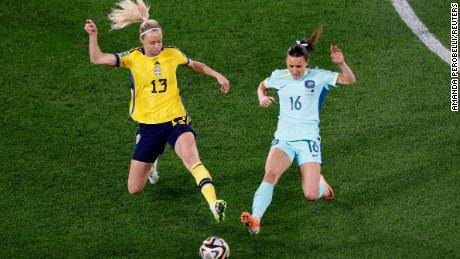 Sweden&#39;s Amanda Ilestedt fights for the ball with Australia&#39;s Hayley Raso.