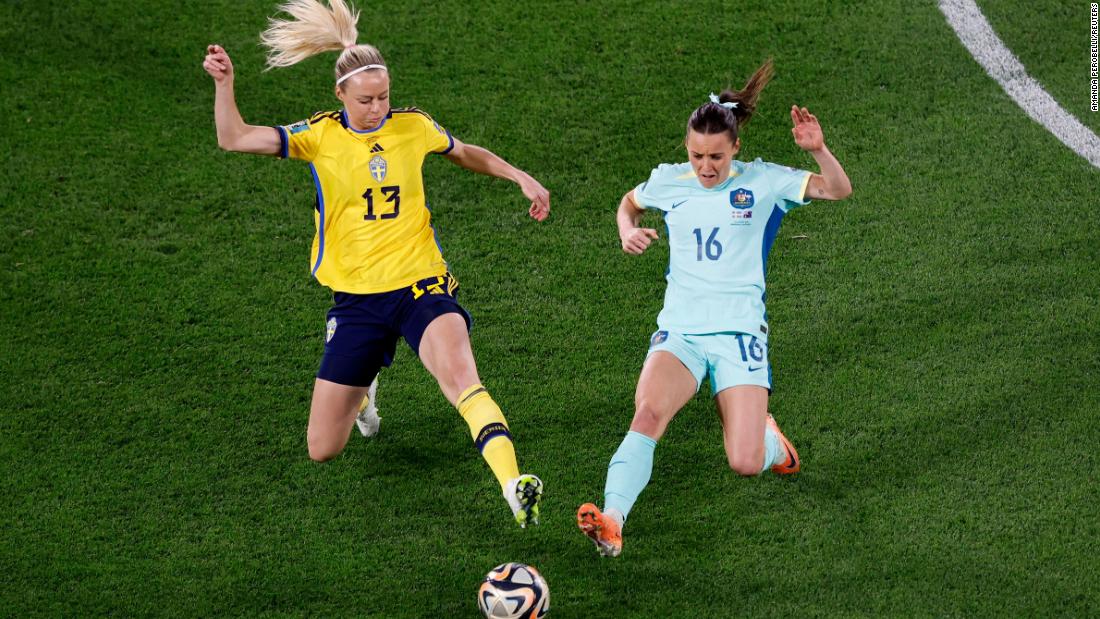 Sweden&#39;s Amanda Ilestedt and Australia&#39;s Hayley Raso compete for the ball.
