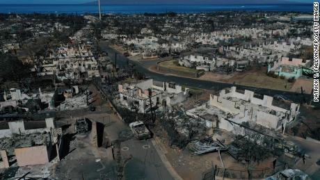An aerial image shows destroyed homes and vehicles on August 17 after a wind-driven wildfire burned through Lahaina, Hawaii.