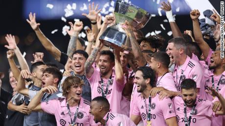 Lionel Messi of Inter Miami hoists the trophy with his teammates after defeating the Nashville SC to win the Leagues Cup 2023 final match at GEODIS Park in Nashville, Tennessee. 