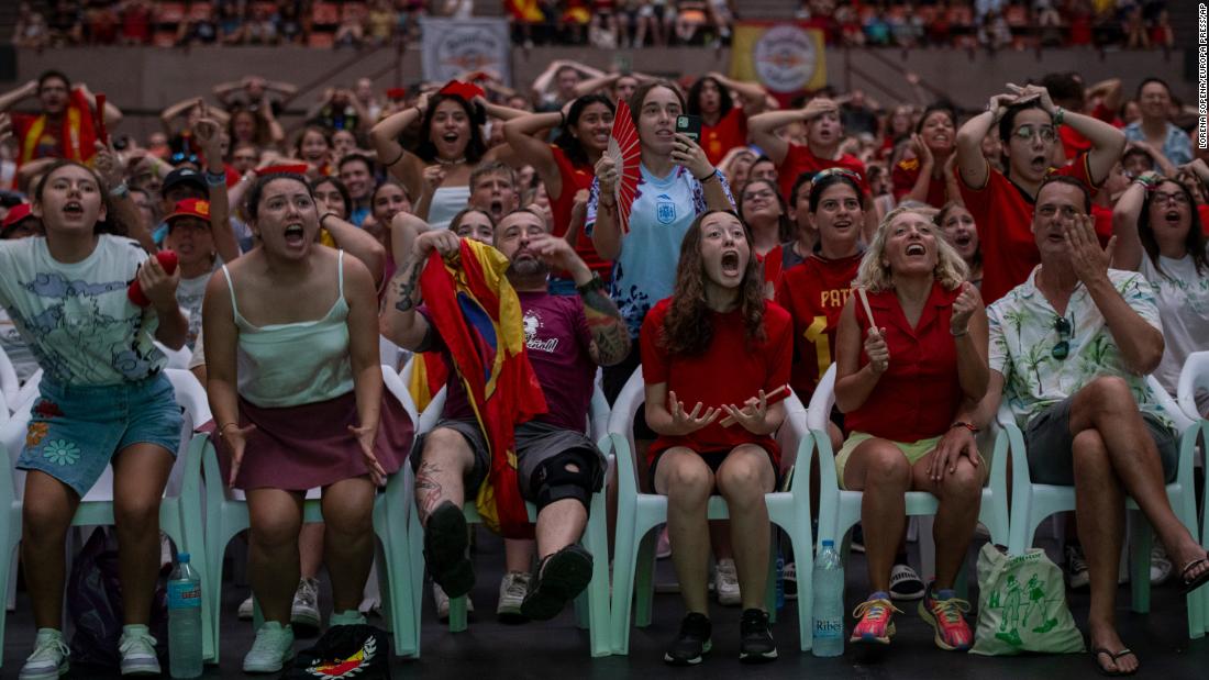 Fans cheer for Spain during a broadcast of match in Barcelona.