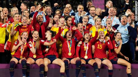 Spain&#39;s team celebrate with the trophy after winning the final of the Women&#39;s World Cup.
