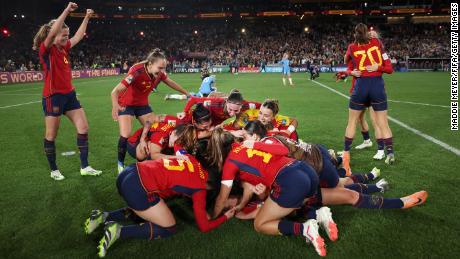Spain players celebrate after beating England. 