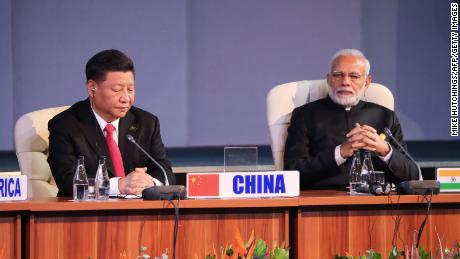 China&#39;s leader Xi Jinping and India&#39;s Prime Minister Narendra Modi attend the 10th BRICS summit on July 27, 2018, in Johannesburg, South Africa. 