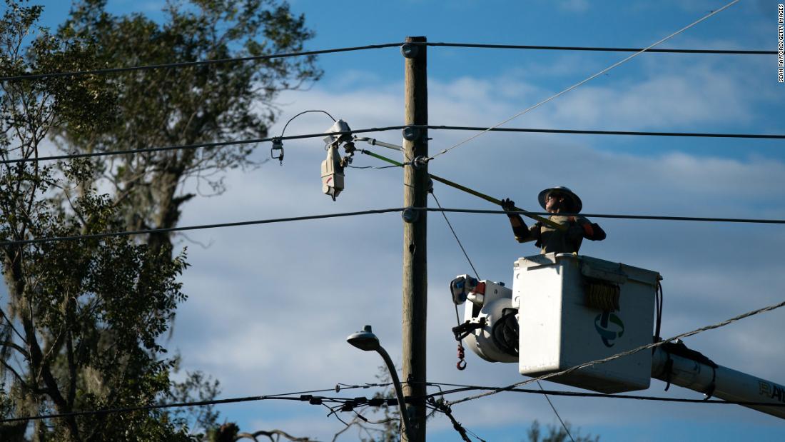 A lineman works to restore service on Thursday, August 31, in Perry, Florida. 