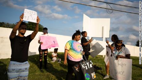 Friends, family and activists at an August 25 protest of the shooting of Ta&#39;Kiya Young.