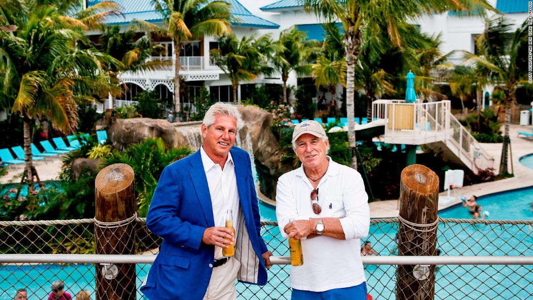 Buffett poses with business partner John Cohlan at the Margaritaville resort in Hollywood, Florida in 2016.