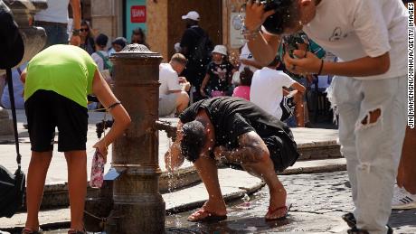 People cool off near the Pantheon in Rome, Italy, on Aug. 22, 2023. Italy experienced severe heat waves this summer.