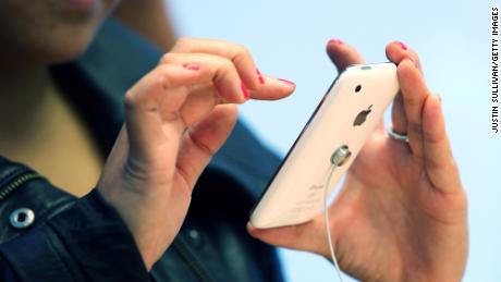 An Apple Store customer plays with the new iPhone 3Gs on June 19, 2009 in San Francisco, California. 