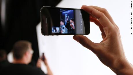 An Apple employee demonstrates &quot;Face Time&quot; on the new iPhone 4 at the 2010 Apple World Wide Developers conference on June 7, 2010 in San Francisco, California. 