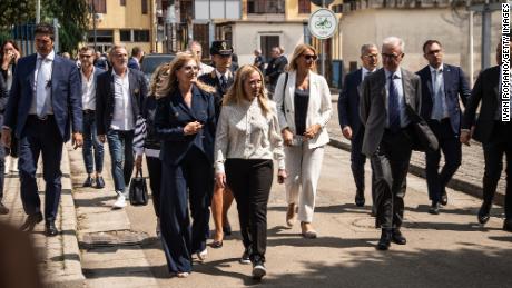 Giorgia Meloni, center, walks in Caivano on August 31, 2023. Her visit was prompted by concerns over drug use and crime in the town, including the alleged rape of two girls by a group of boys.