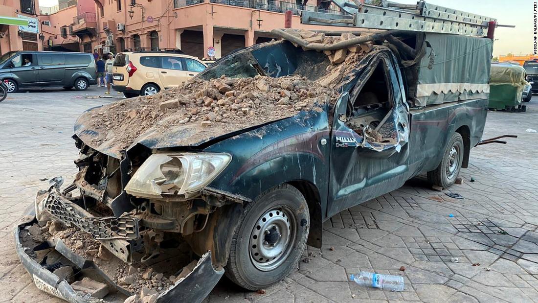 A damaged vehicle sits in a street in Marrakech on September 9.