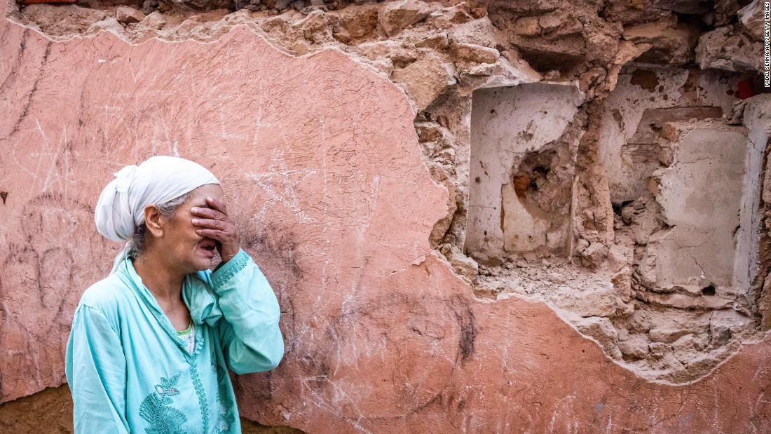 A woman stands in front of her earthquake-damaged house in Marrakech on September 9. &lt;br /&gt;