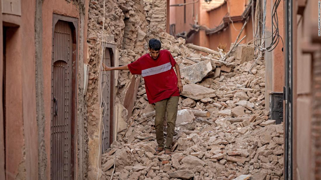 A Marrakech resident navigates through the rubble on September 9.