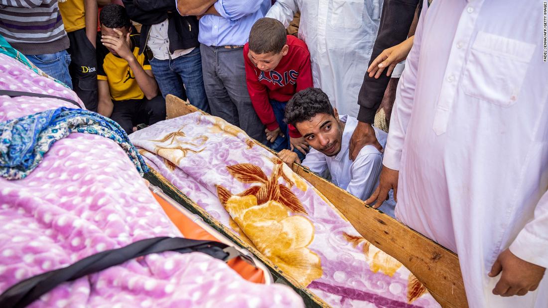 People mourn victims in Moulay Brahim on September 9.