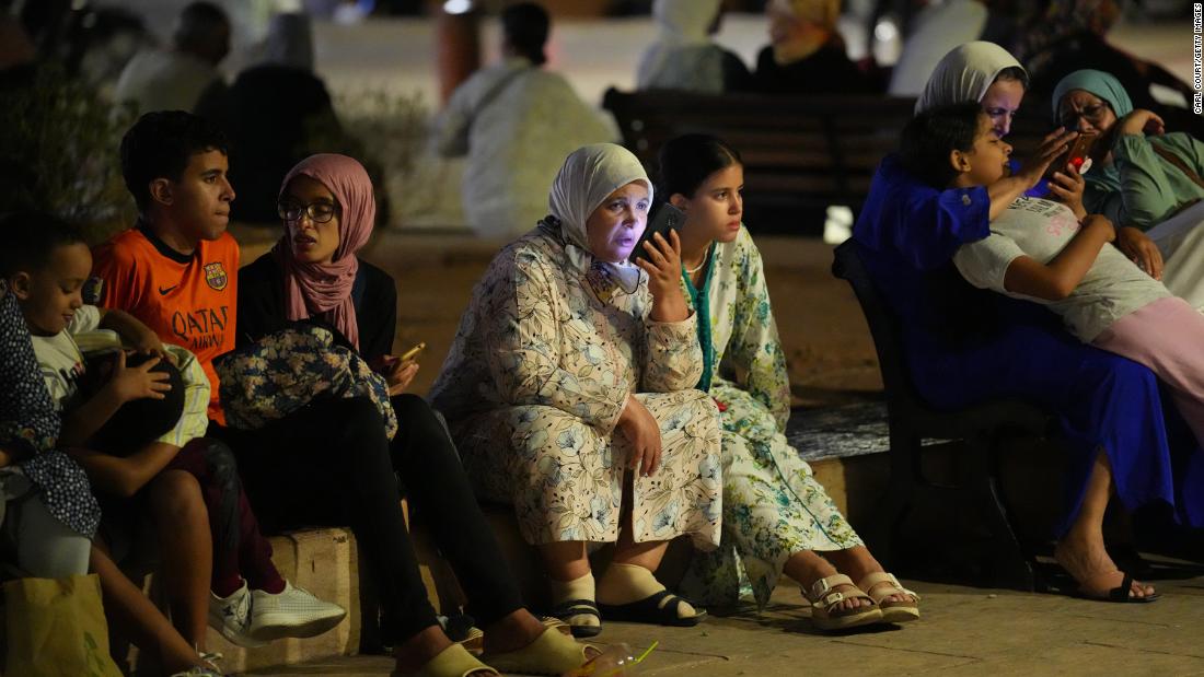 People take shelter in a Marrakech park on September 9.