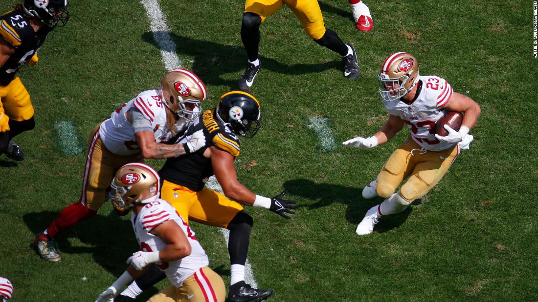 San Francisco 49ers running back Christian McCaffrey looks for space to run the ball in the second half of a 30-7 win over the Pittsburgh Steelers at Acrisure Stadium in Pittsburgh on Sunday, September 10.