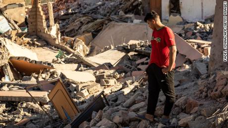 A man looks at the rubble of homes in the village of Talat N&#39;Yacoub, south of Marrakech, on Monday.