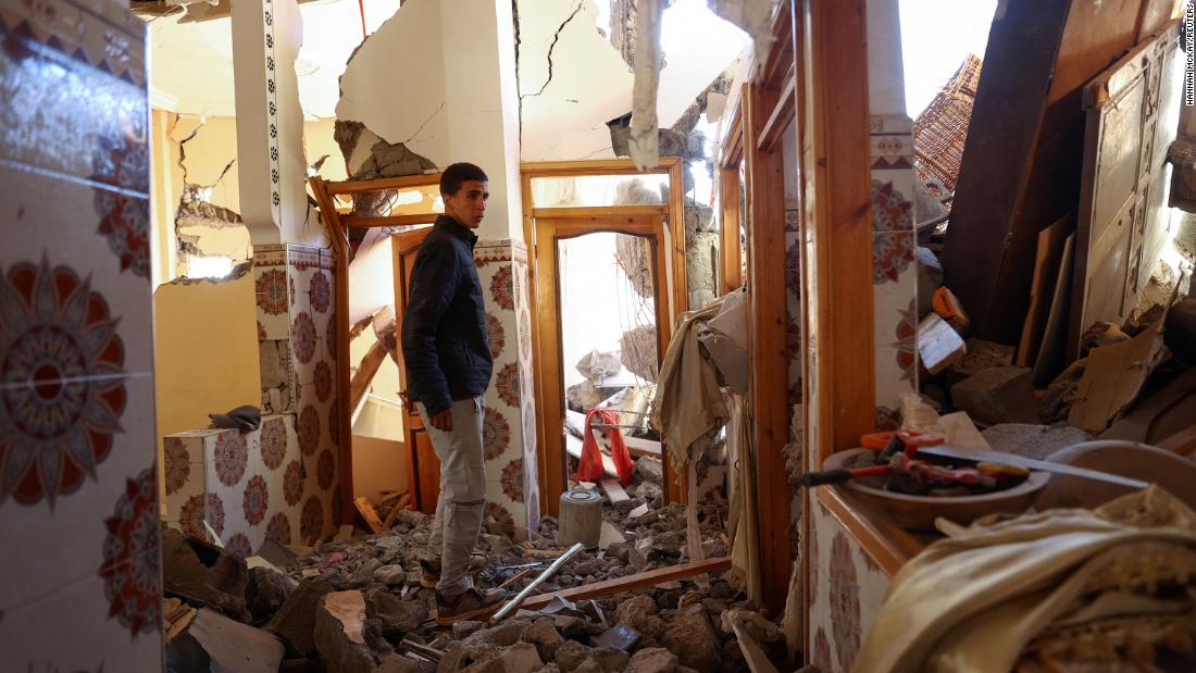 Mouath Aytnasr walks in his damaged house on the outskirts of Talat N&#39;Yaaqoub on September 11. He lost his 7-year-old brother, Suleiman, in the earthquake.