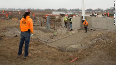 The first piece of steel for the Stellantis and Samsung joint venture EV battery plant is raised earlier this year.