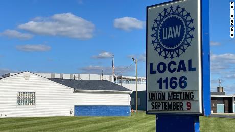 The EV battery plant being built by Stellantis and Samsung in Kokomo, in the background, is right across the street from one of the United Auto Workers union halls in the town where current unionized factories could be threatened by the shift to EVs.