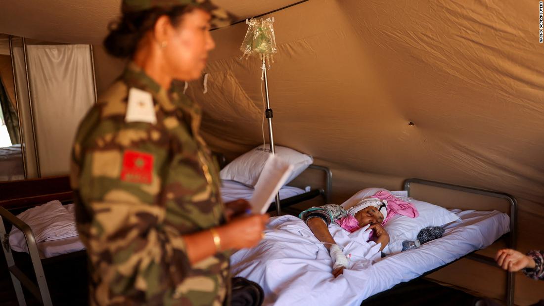 An earthquake survivor lies in bed at a field hospital in Asni, Morocco, on September 13.