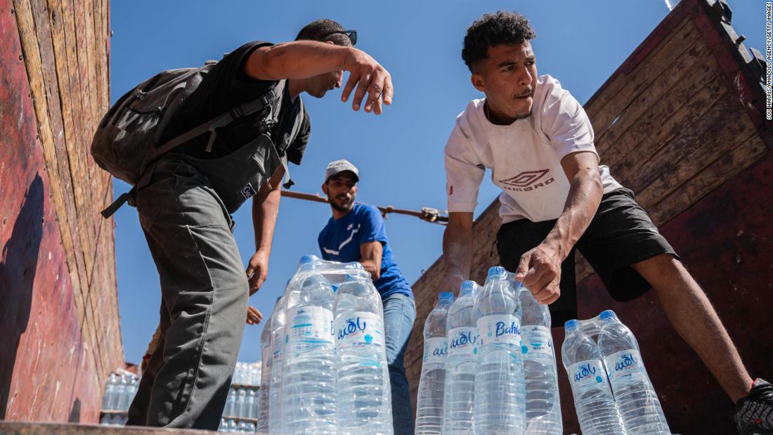 The Moroccan Civil Defense Institution provides water for earthquake victims as search-and-rescue operations continue in Talat N&#39;Yaaqoub on Wednesday, September 13.